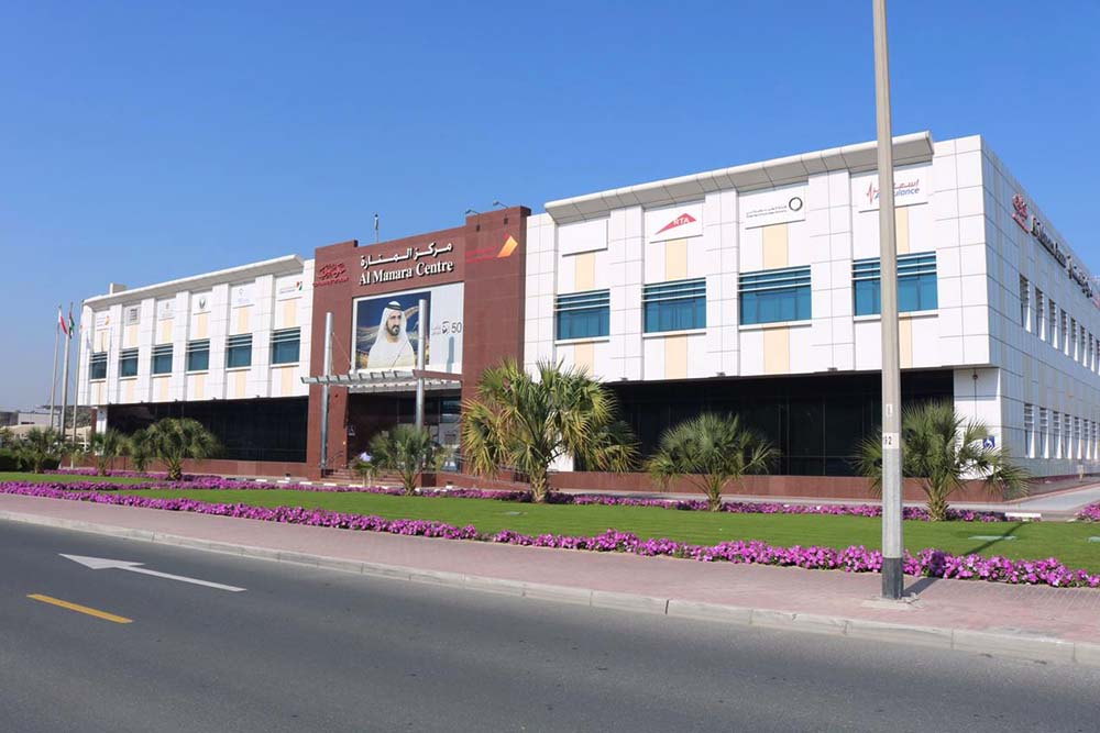 Al Manara Centre Dubai exterior view showing main entrance and landscaping